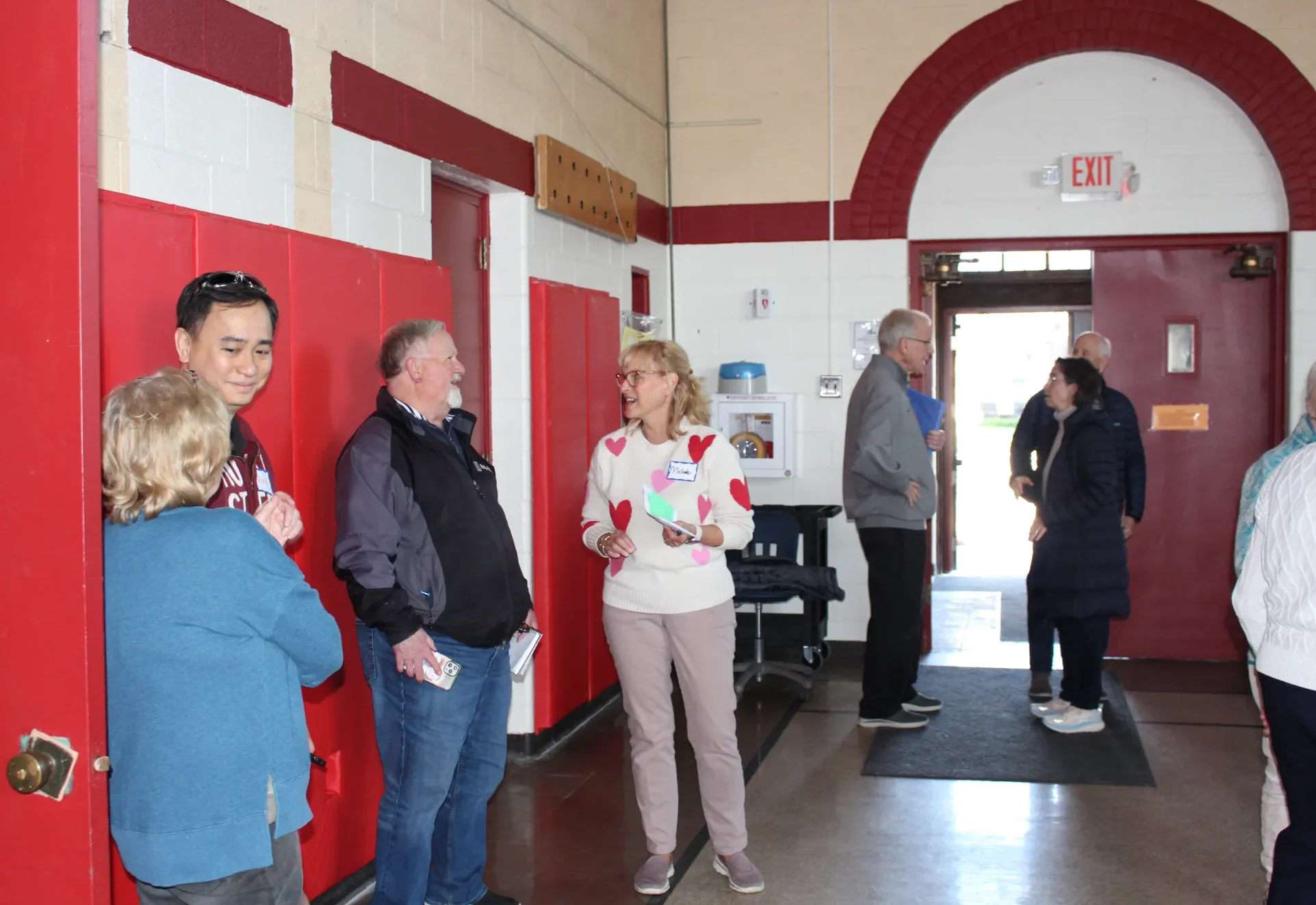 Small groups of adults mingling and talking