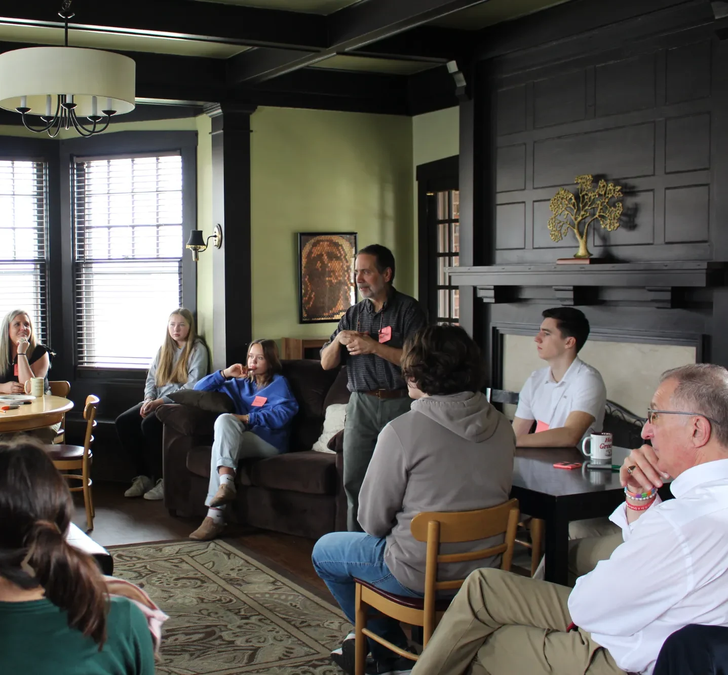 A man teaching a group of adults