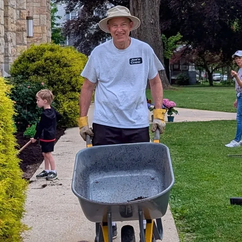 a man with a wheelbarrow