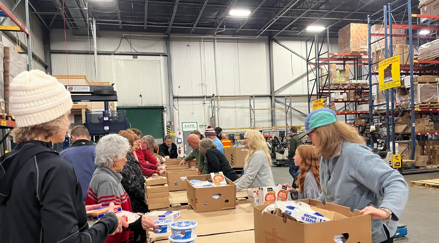 A group of parishioners putting food in boxes