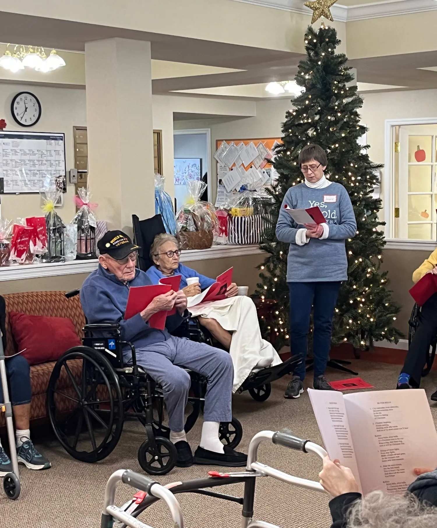 A group of people singing carols